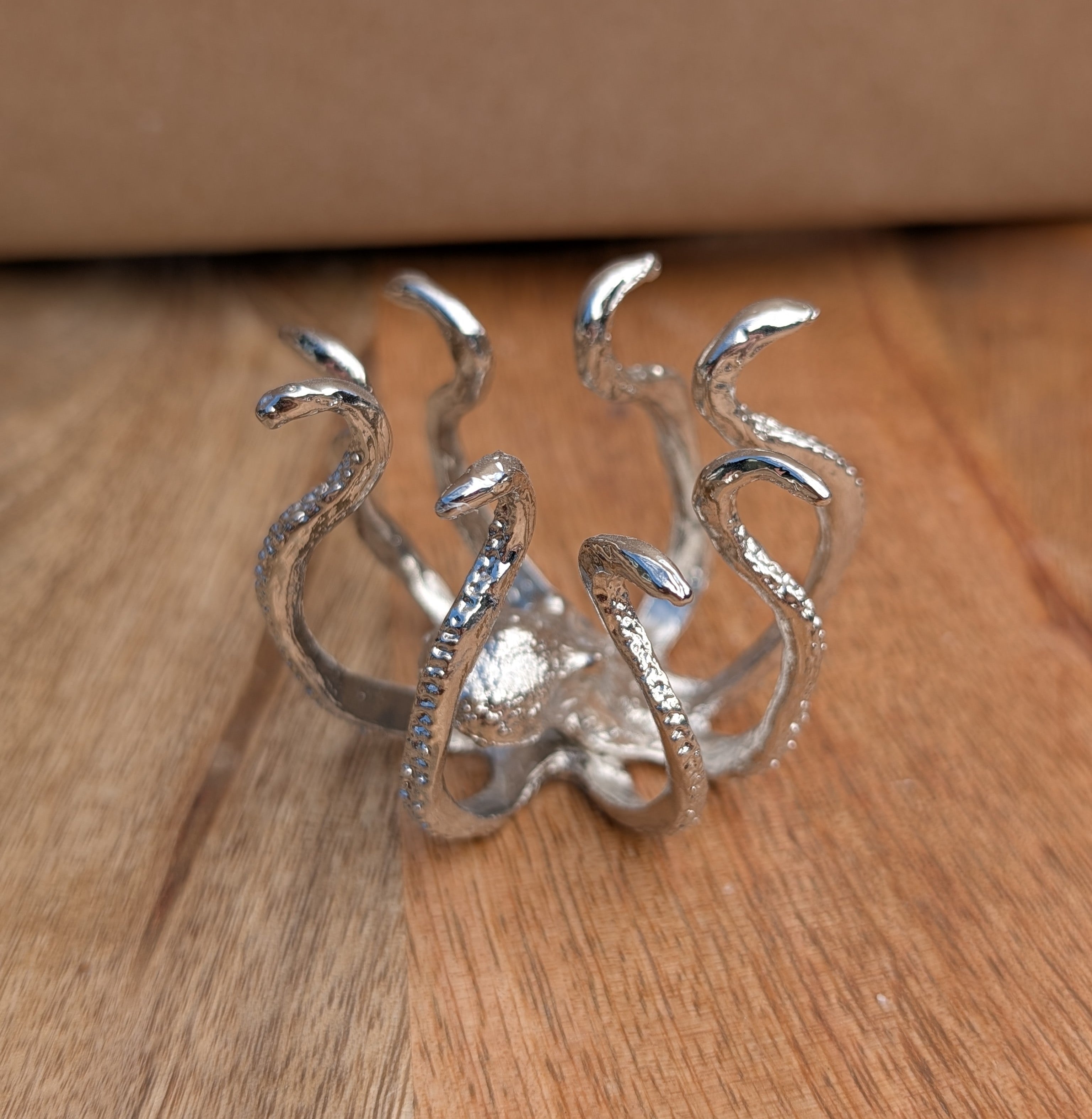 Moonstone Sphere with Silver Octopus Stand