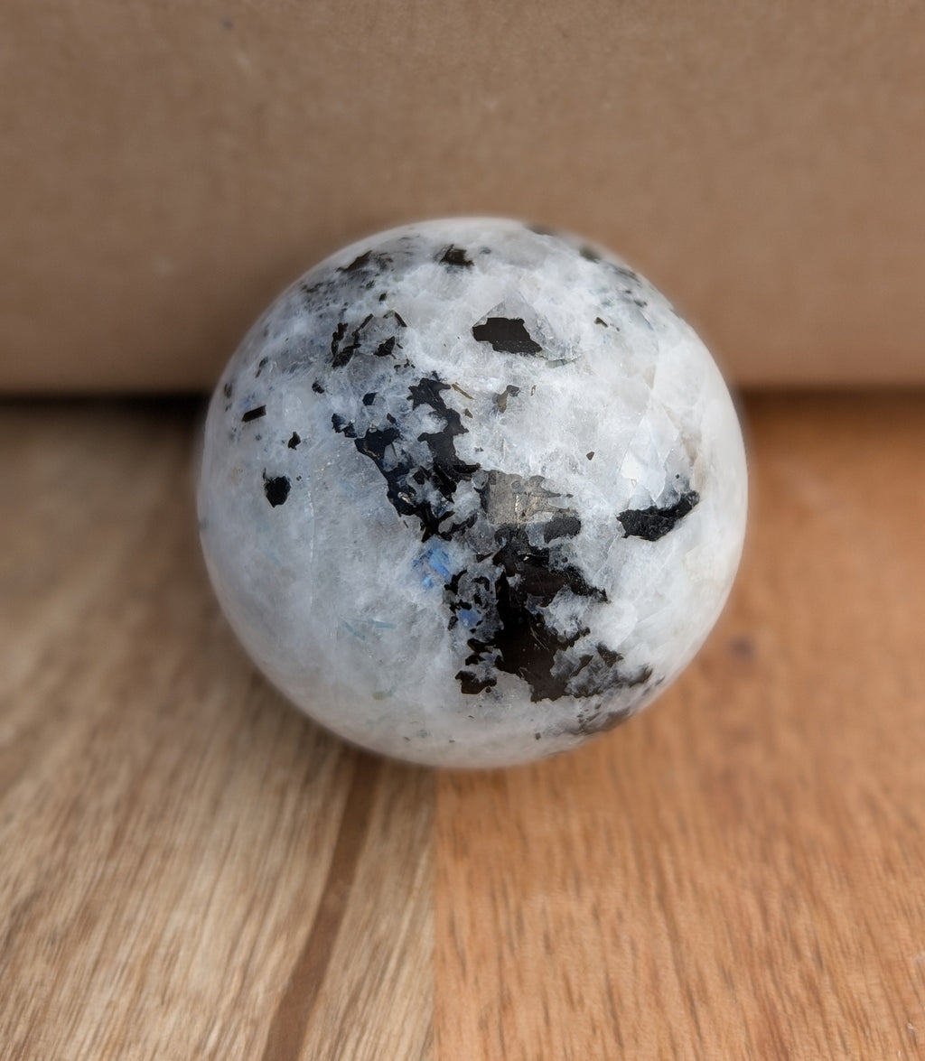 Moonstone Sphere with Silver Octopus Stand